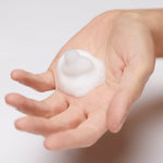 Model dispensing Foaming Cleanser from pump into hand