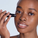 Model applying BL+ The Eye Serum under eyes