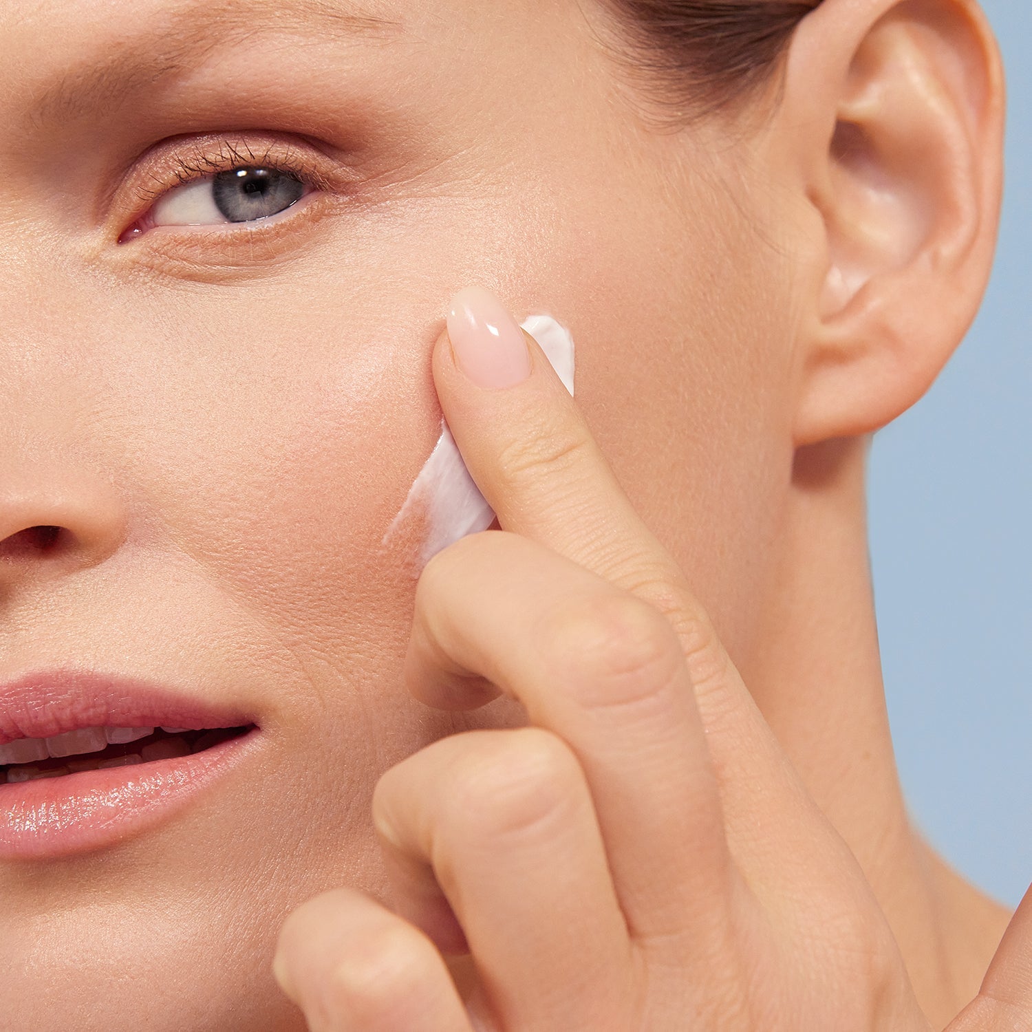 Model applying BL+ The Cream to face