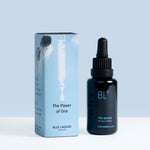 BL+ The Serum with BL+ COMPLEX in black glass bottle next to light blue product box